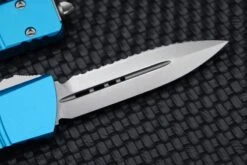 Microtech Combat Troodon Double Edge Fully Serrated Stonewash & Turquoise 142-12TQ -Nc Blade image 1041aa75 6ed4 43ac b5be a9a717f24aee