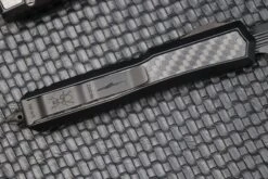 Microtech Makora Shadow DLC D/E Full Serrated W/ DLC Hardware Nickel Boron Internals & Carbon Fiber Inlays 206-3DLCTCFISH -Nc Blade image a9cbf50e 11d6 47d2 9efa 6f407684fd00