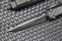 Microtech Makora Shadow DLC D/E Full Serrated W/ DLC Hardware Nickel Boron Internals & Carbon Fiber Inlays 206-3DLCTCFISH -Nc Blade image ca11e606 ed70 49a8 9b41 01d6c32c860b